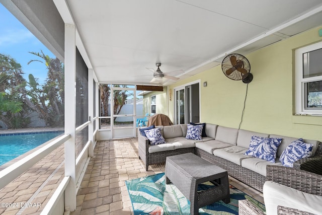 sunroom featuring ceiling fan