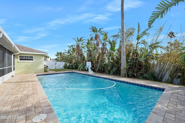 view of swimming pool with a patio area