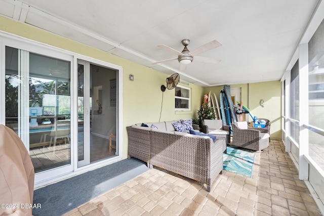 sunroom featuring ceiling fan