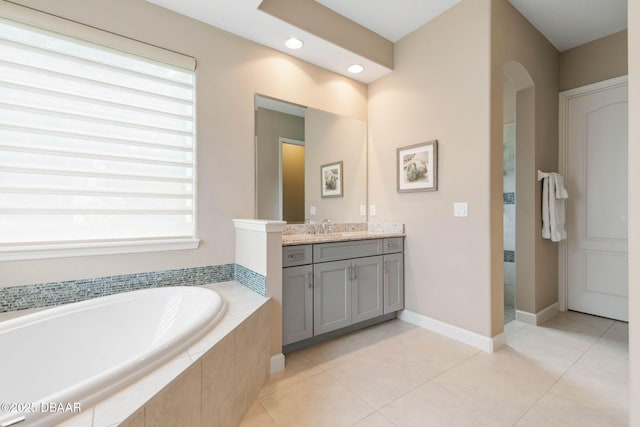 bathroom featuring separate shower and tub, vanity, and tile patterned floors