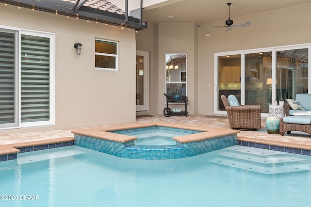 view of swimming pool featuring a patio, ceiling fan, and an in ground hot tub