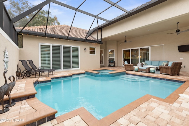 view of swimming pool with an in ground hot tub, a patio, outdoor lounge area, and ceiling fan