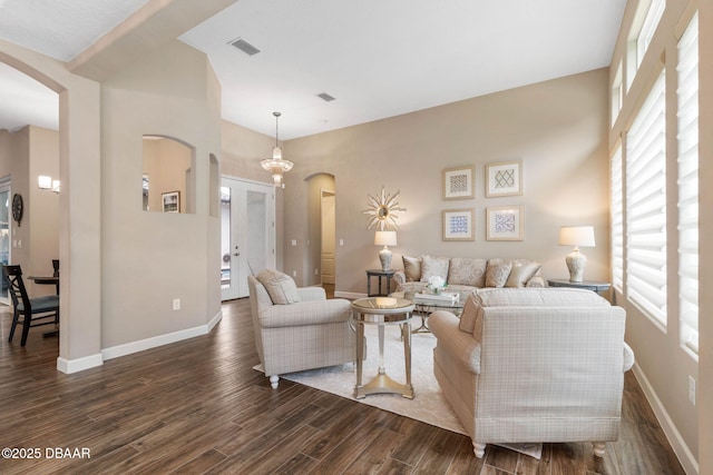 living room with dark hardwood / wood-style flooring