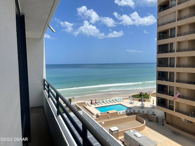 balcony with a beach view and a water view