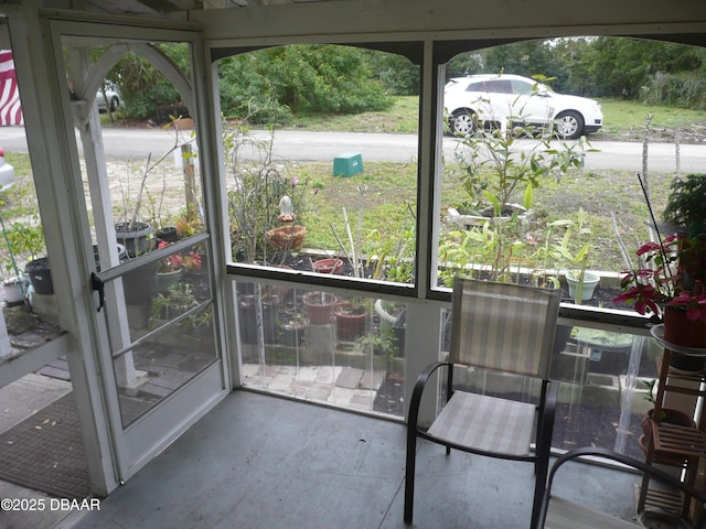 unfurnished sunroom featuring a healthy amount of sunlight