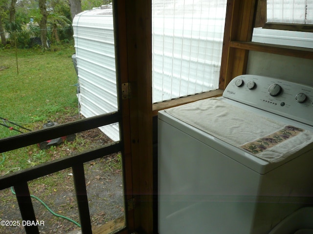 laundry area with laundry area and washer / dryer