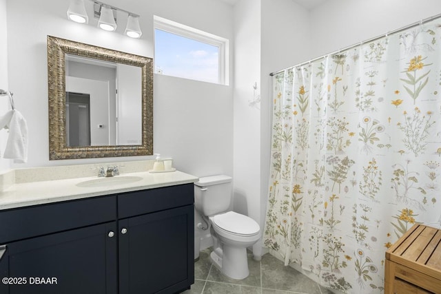 bathroom with vanity, toilet, and tile patterned flooring