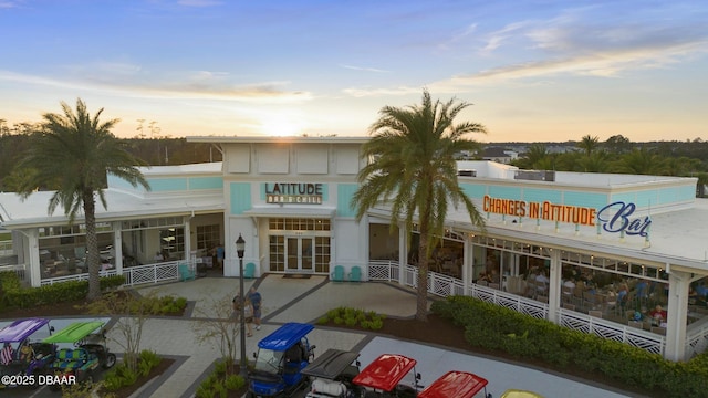 view of outdoor building at dusk