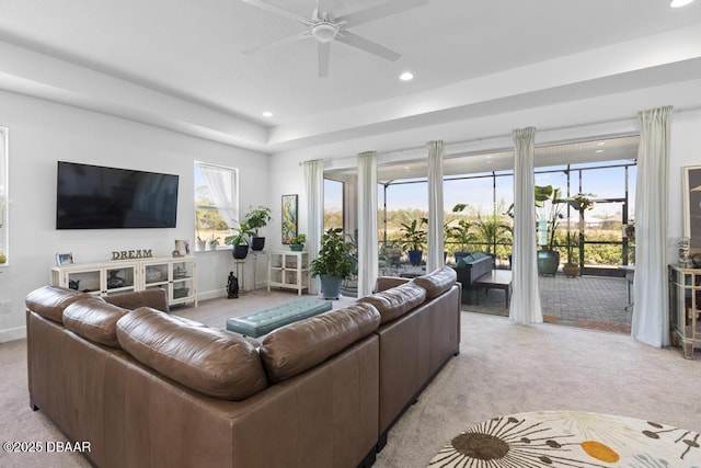 living room with light carpet and ceiling fan