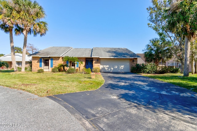 single story home with a garage and a front yard