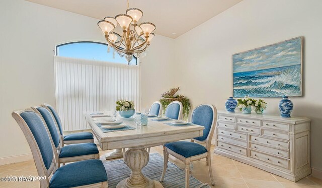 540 Leeway Trl, Ormond Beach, FL 32174 - dining area with a chandelier, light tile patterned floors, and lofted ceiling