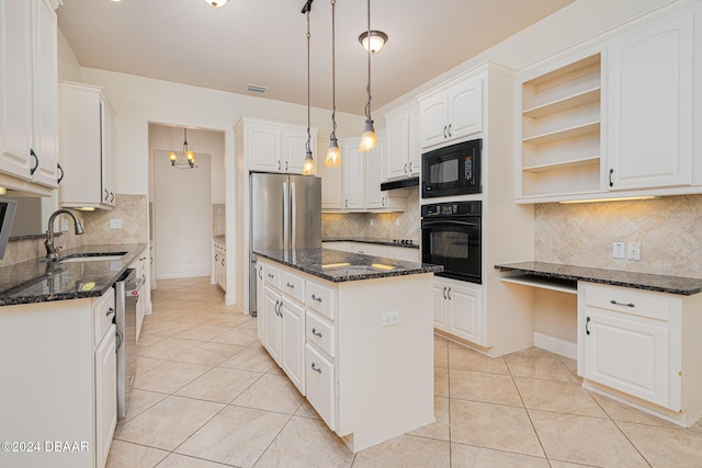 540 Leeway Trl, Ormond Beach, FL 32174 - kitchen featuring black appliances, a kitchen island, dark stone counters, and open shelves