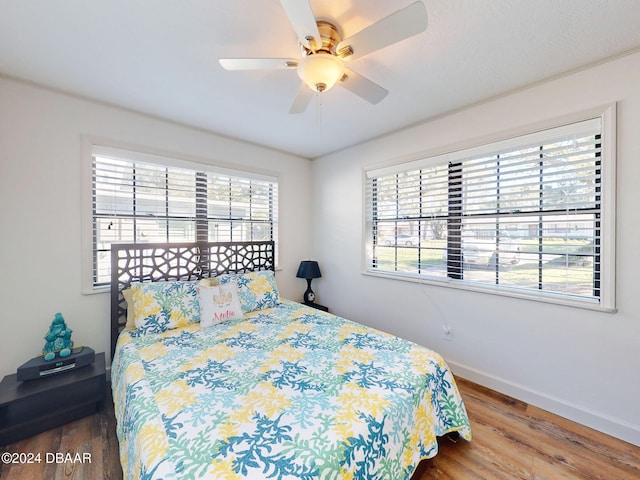 bedroom featuring hardwood / wood-style floors and ceiling fan