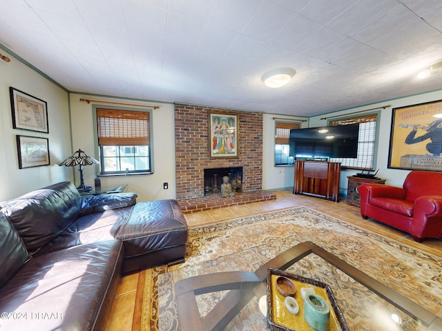 living room with tile patterned flooring and a brick fireplace