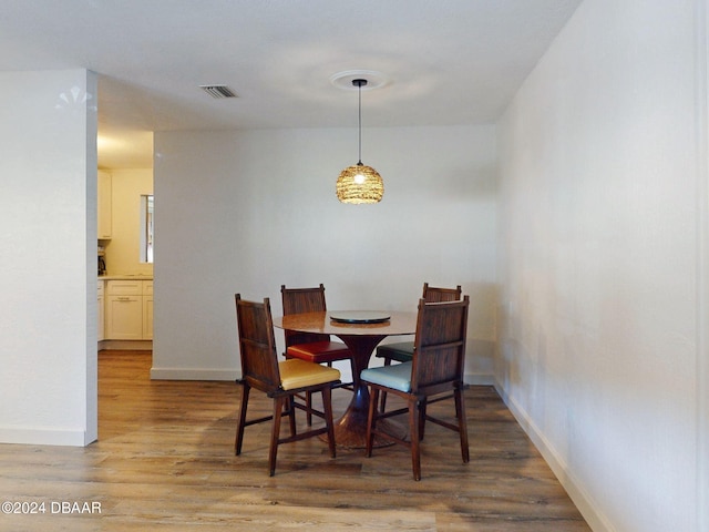 dining area with light hardwood / wood-style flooring