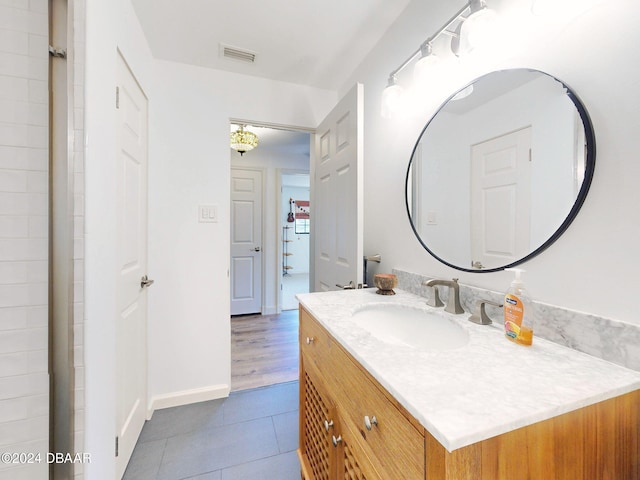 bathroom with hardwood / wood-style floors and vanity