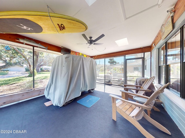 sunroom featuring ceiling fan