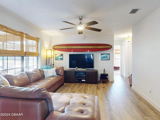 living room with hardwood / wood-style floors and ceiling fan