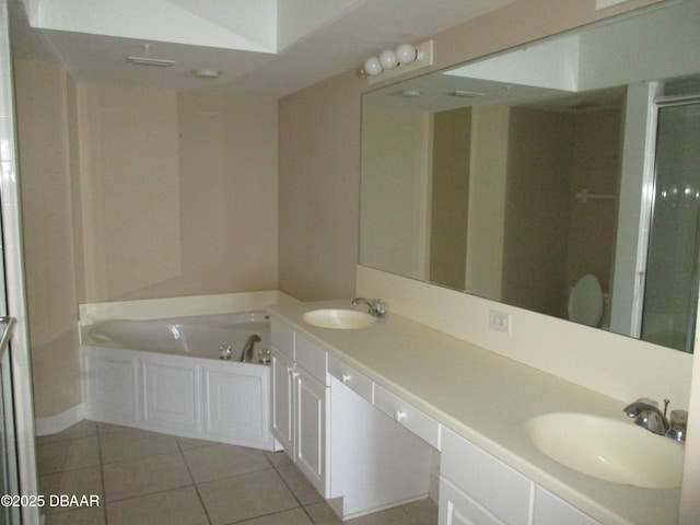 2055 S Atlantic Ave Unit 1004, Daytona Beach, FL 32118 - full bathroom with tile patterned flooring, double vanity, a garden tub, and a shower stall