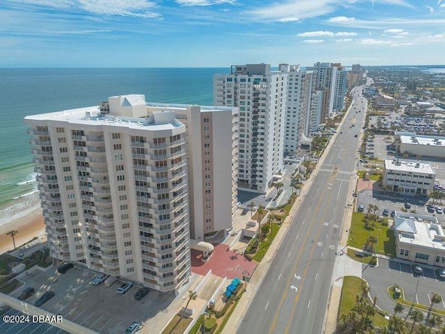 birds eye view of property featuring a view of the beach and a water view