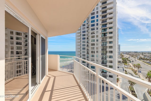 balcony featuring a water view