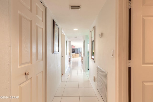 hallway featuring light tile patterned floors