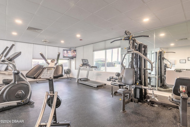 gym featuring a paneled ceiling