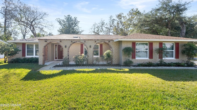 ranch-style house with a front lawn