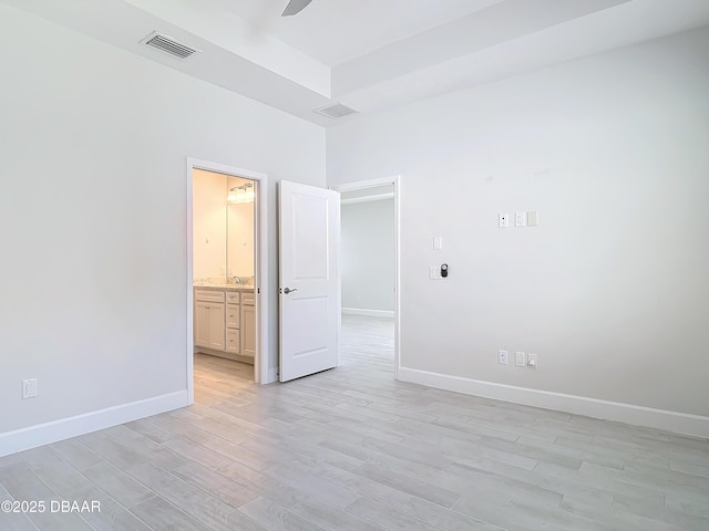 empty room with ceiling fan and light wood-type flooring