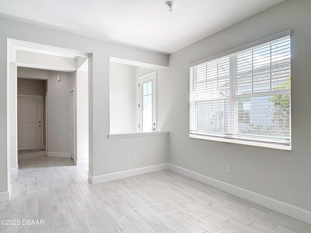 spare room with light hardwood / wood-style floors