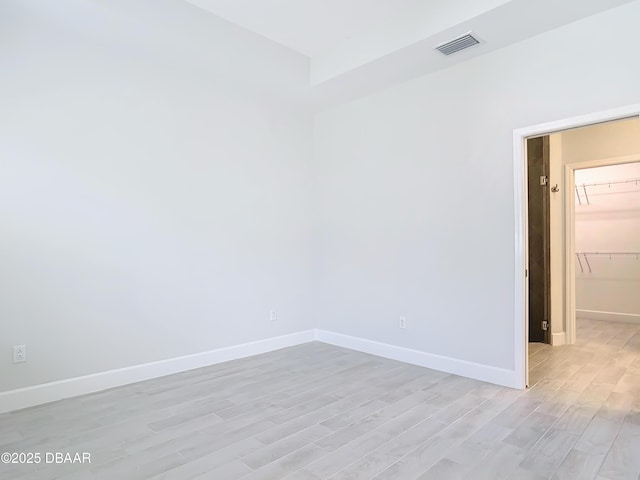 spare room with light hardwood / wood-style floors