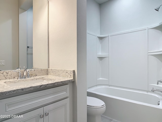 full bathroom featuring vanity, tub / shower combination, and toilet