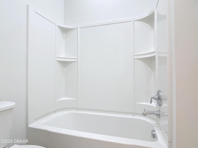 bathroom with shower / bathtub combination and toilet