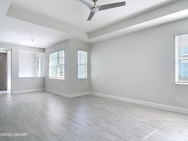 spare room featuring light wood-type flooring and ceiling fan