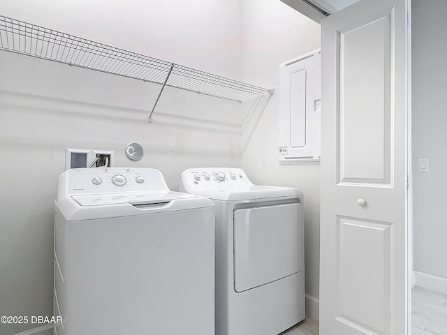 clothes washing area with separate washer and dryer