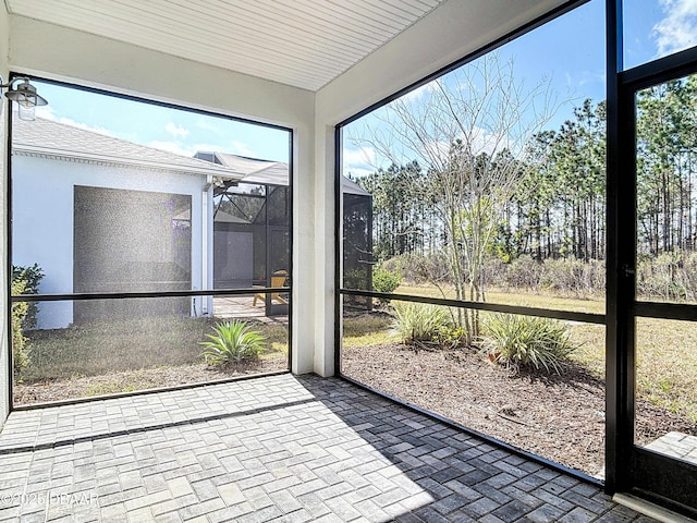 unfurnished sunroom featuring a healthy amount of sunlight