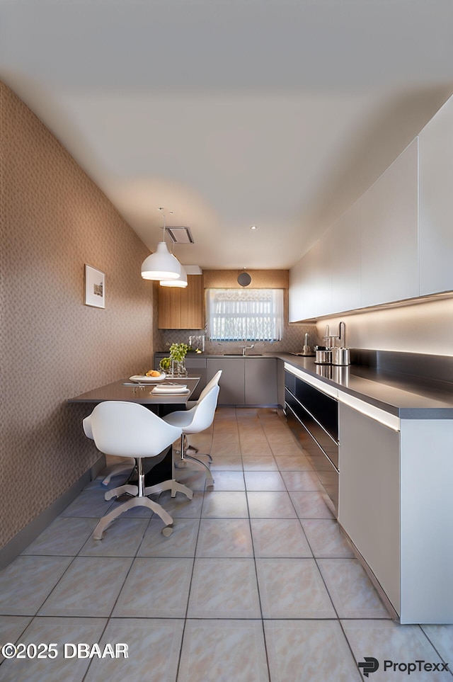 45 Harvard Dr, Ormond Beach, FL 32176 - kitchen with tasteful backsplash, a sink, wallpapered walls, light tile patterned floors, and pendant lighting