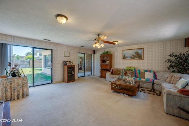 45 Harvard Dr, Ormond Beach, FL 32176 - carpeted living area featuring wallpapered walls, visible vents, and ceiling fan