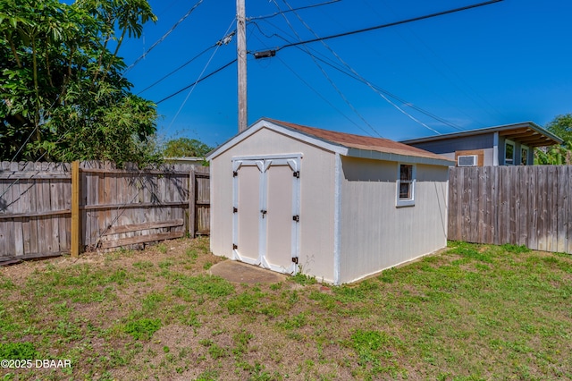 45 Harvard Dr, Ormond Beach, FL 32176 - view of shed with a fenced backyard