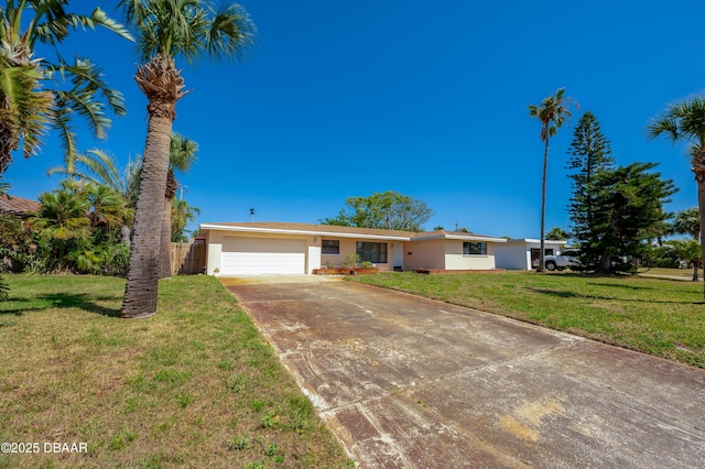 45 Harvard Dr, Ormond Beach, FL 32176 - ranch-style home with stucco siding, a front lawn, driveway, and a garage