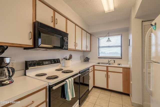 kitchen featuring sink, light tile patterned floors, pendant lighting, white cabinets, and black appliances