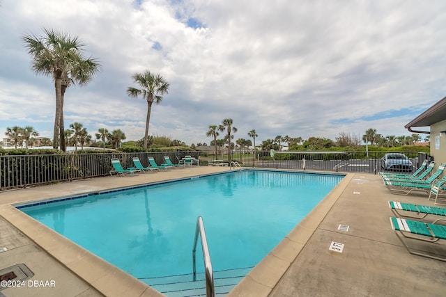 view of swimming pool with a patio area