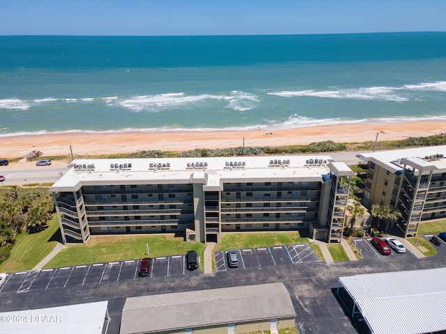 aerial view with a view of the beach and a water view