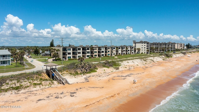 bird's eye view with a water view and a view of the beach