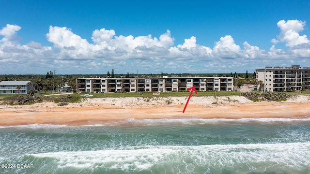 bird's eye view with a view of the beach and a water view