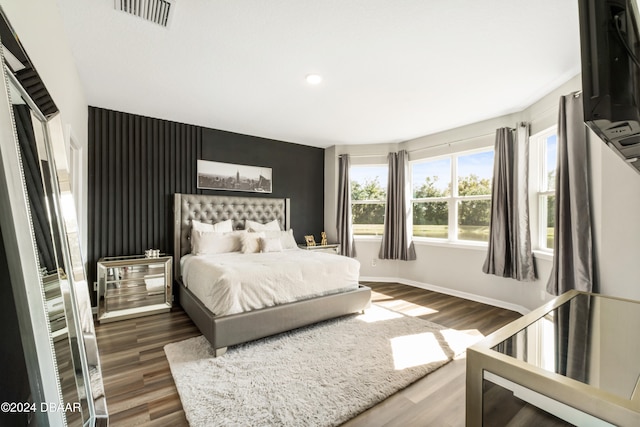 bedroom with dark wood-type flooring