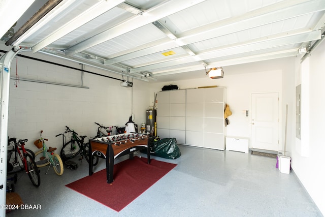 garage with water heater and a garage door opener