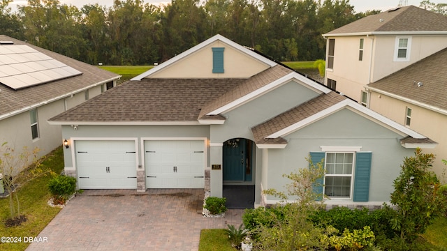 view of front of property featuring a garage