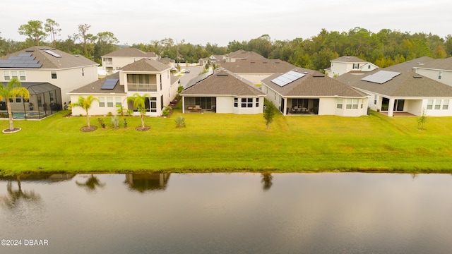 drone / aerial view with a water view