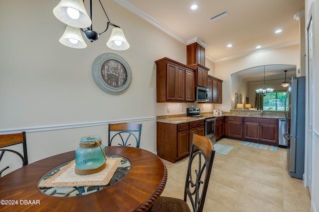 kitchen with appliances with stainless steel finishes, light stone countertops, decorative light fixtures, crown molding, and a notable chandelier